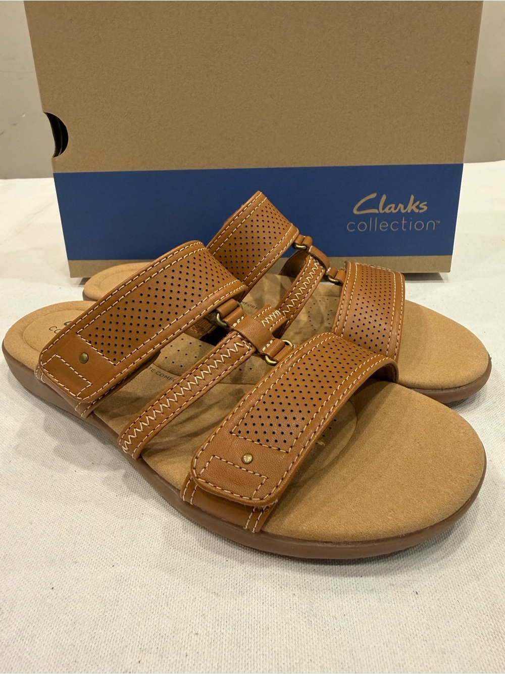Clarks Women's Elizabelle Ave Slip-On Flat Sandal Color Tan Leather